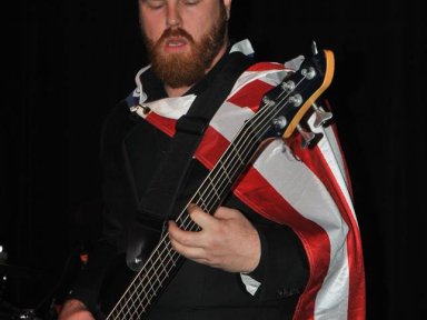Aric wearing American flag cape