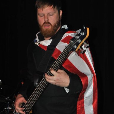 Aric wearing American flag cape